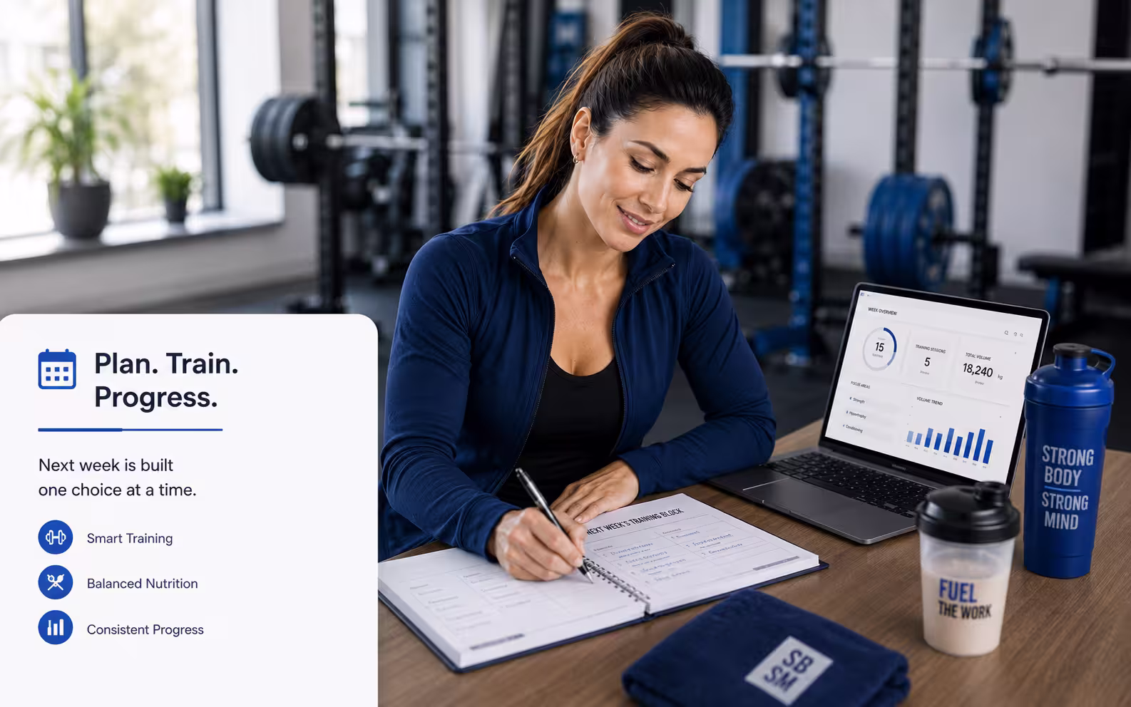 Sarah writing next week's training block at the gym